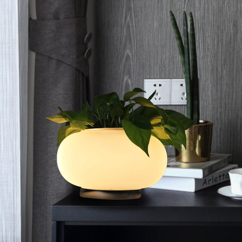 Owalna biała szklana lampa stołowa w stylu industrialnym LED lampka nocna z akcentem roślinnym